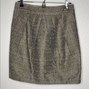 Metallic skirt with asymmetric pleats by Tabitha